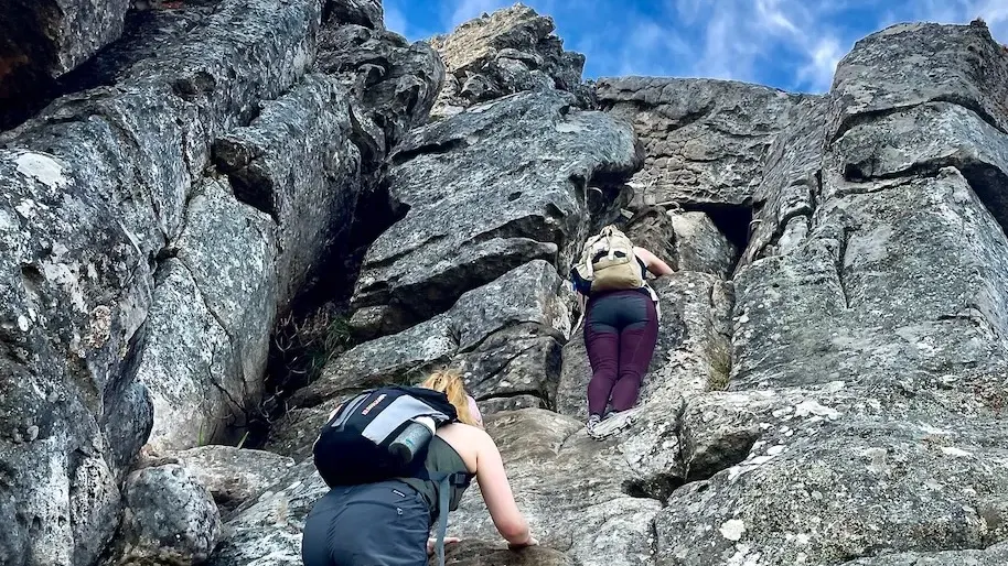 A hiker scrambling up the India Venster route on Table Mountain