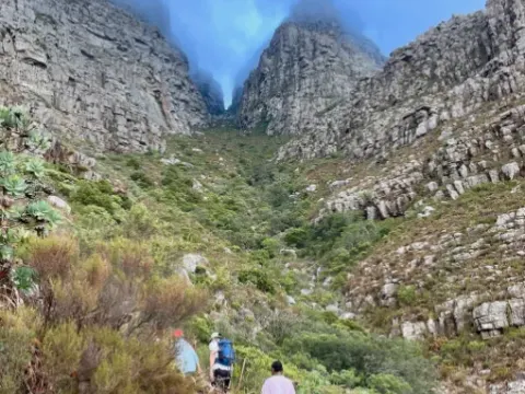 Hikers climbing the stone steps of Platteklip Gorge on Table Mountain