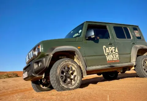 A Suzuki Jimny on Chapman's Peak Drive